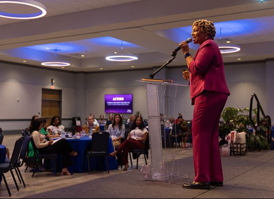 Female presenter address conference participants at the WILL Spring 2026 Conference in the Campus Center.