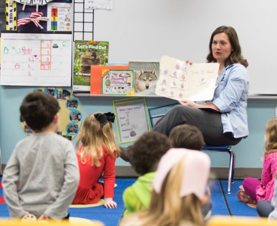 Teacher reading to children