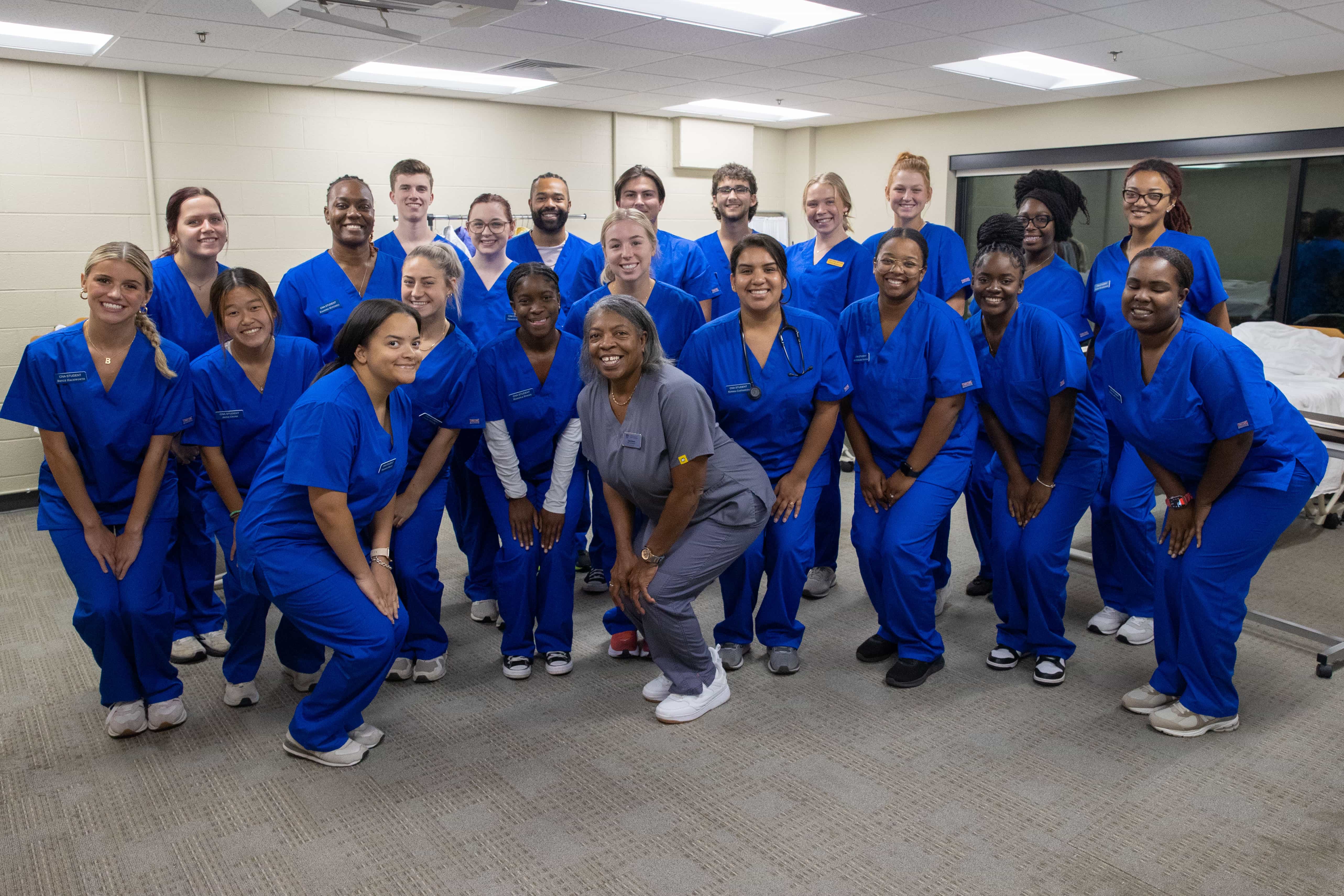 Group photo of nursing students with professor.