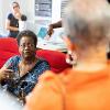 Elderly individuals gathered around chatting.