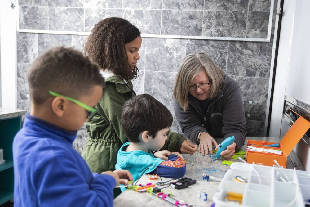 Students inside the Mobile Innovations Lab exploring hands on STEM activities