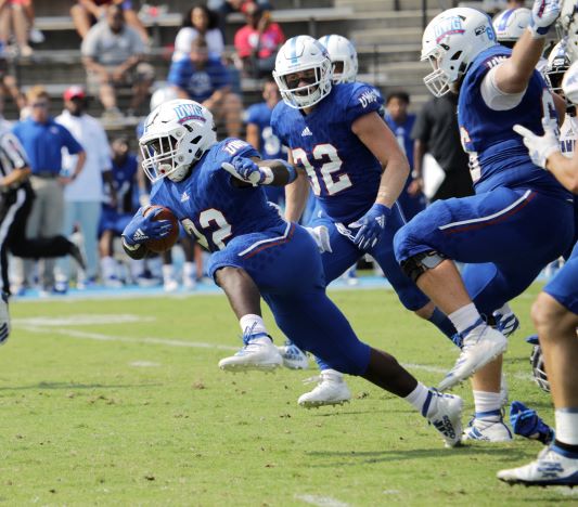 Football players running