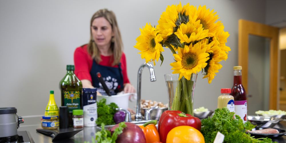 Professor teaching students about nutrition inside a food lab