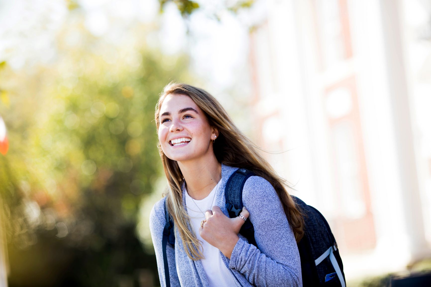girl smiling while walking