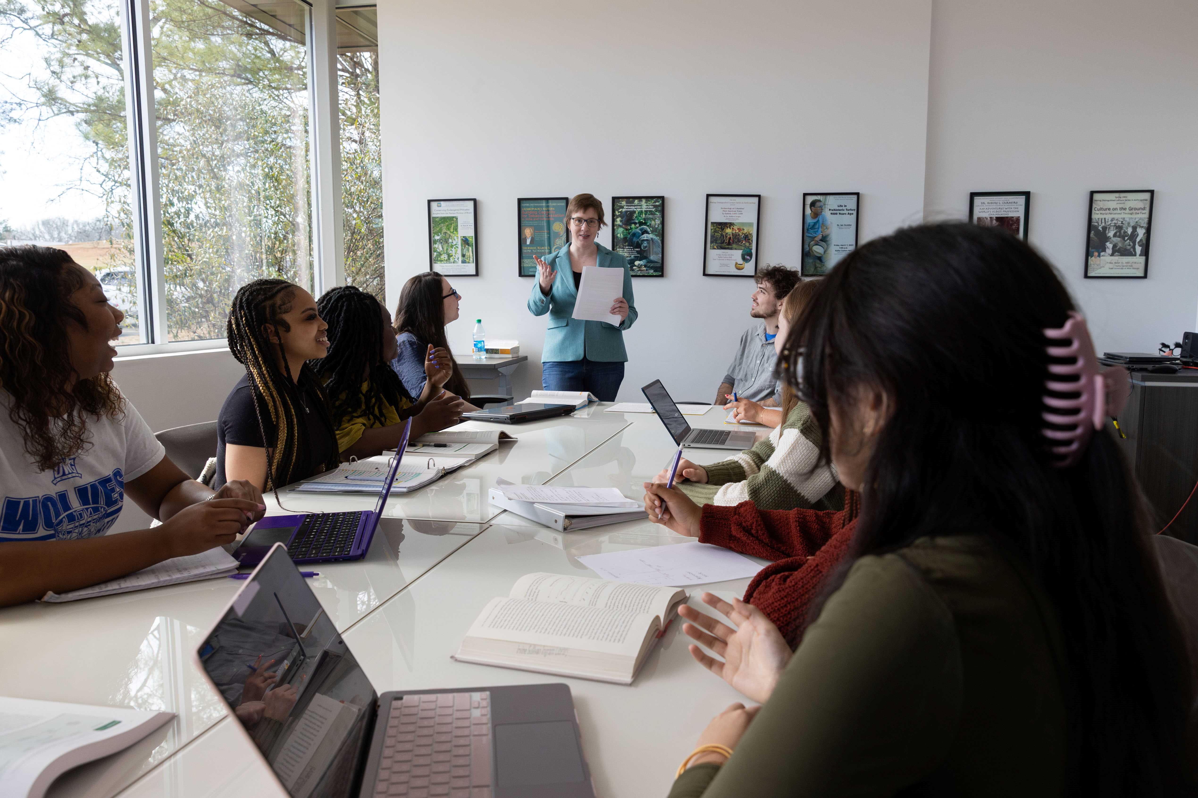 Professor teaching in a classroom full of students.