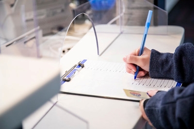 Person signing in to health services