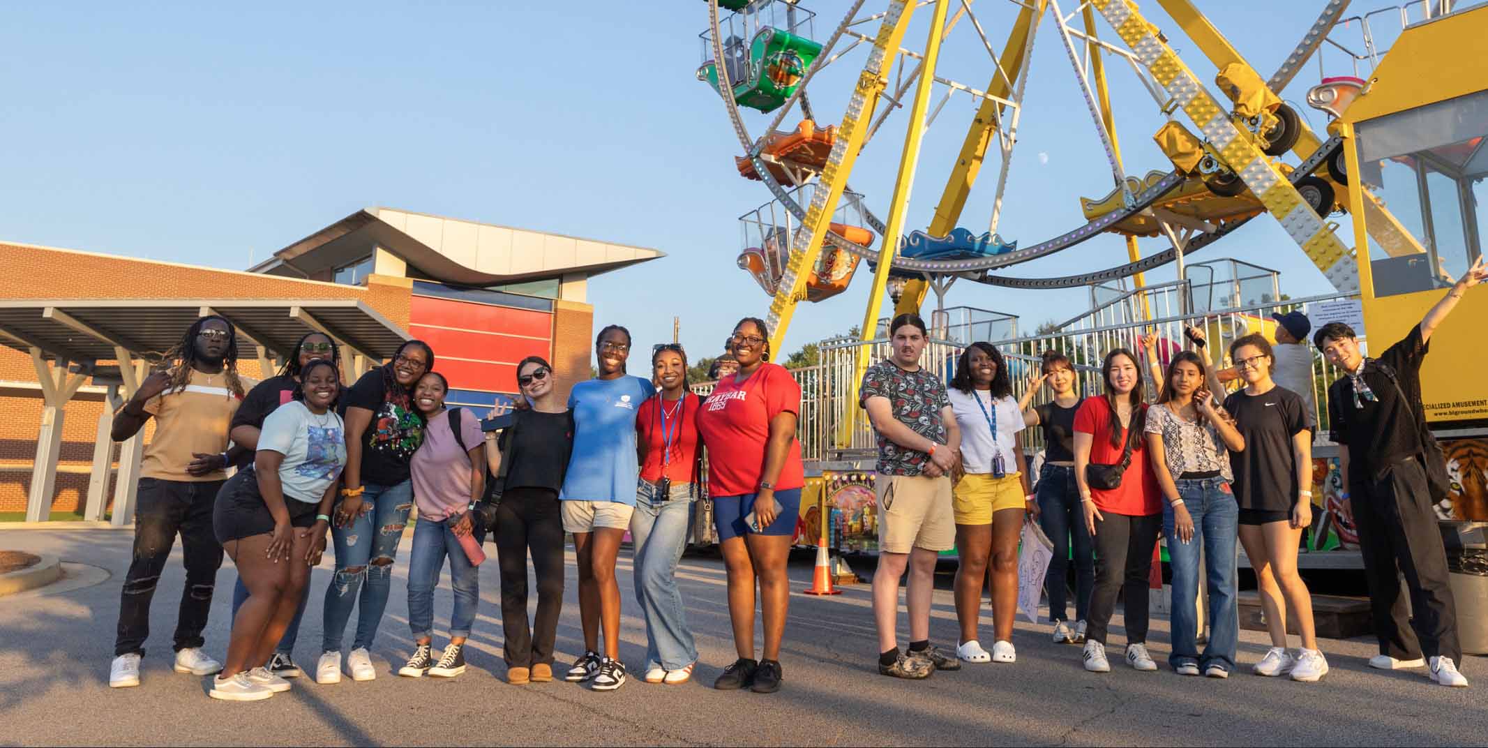 Group of students in front of ferris wheel