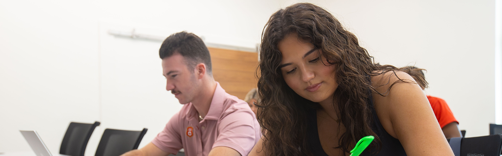 Students taking notes in a UWG classroom.