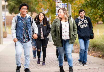 Five students walking outside