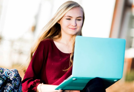Girl with a laptop outside