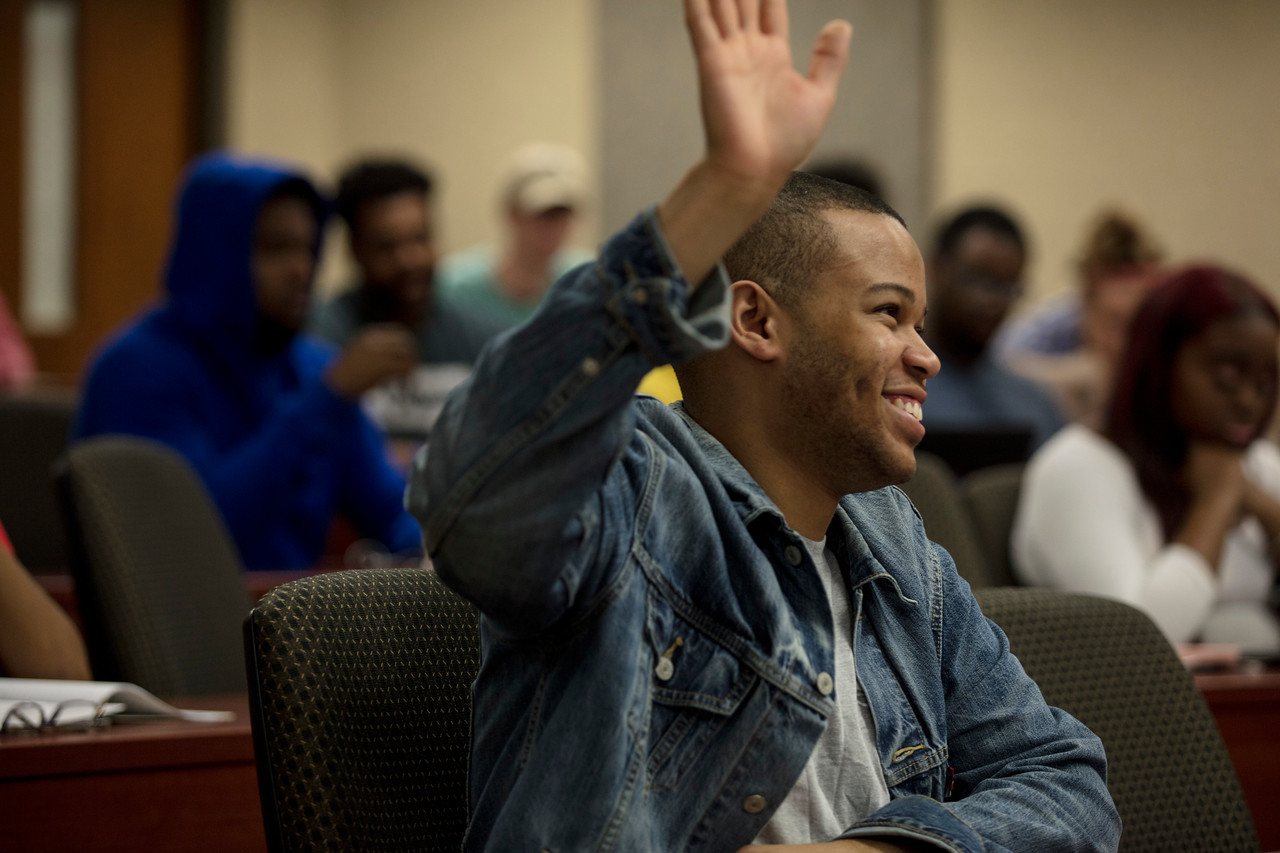 Student with hand raised