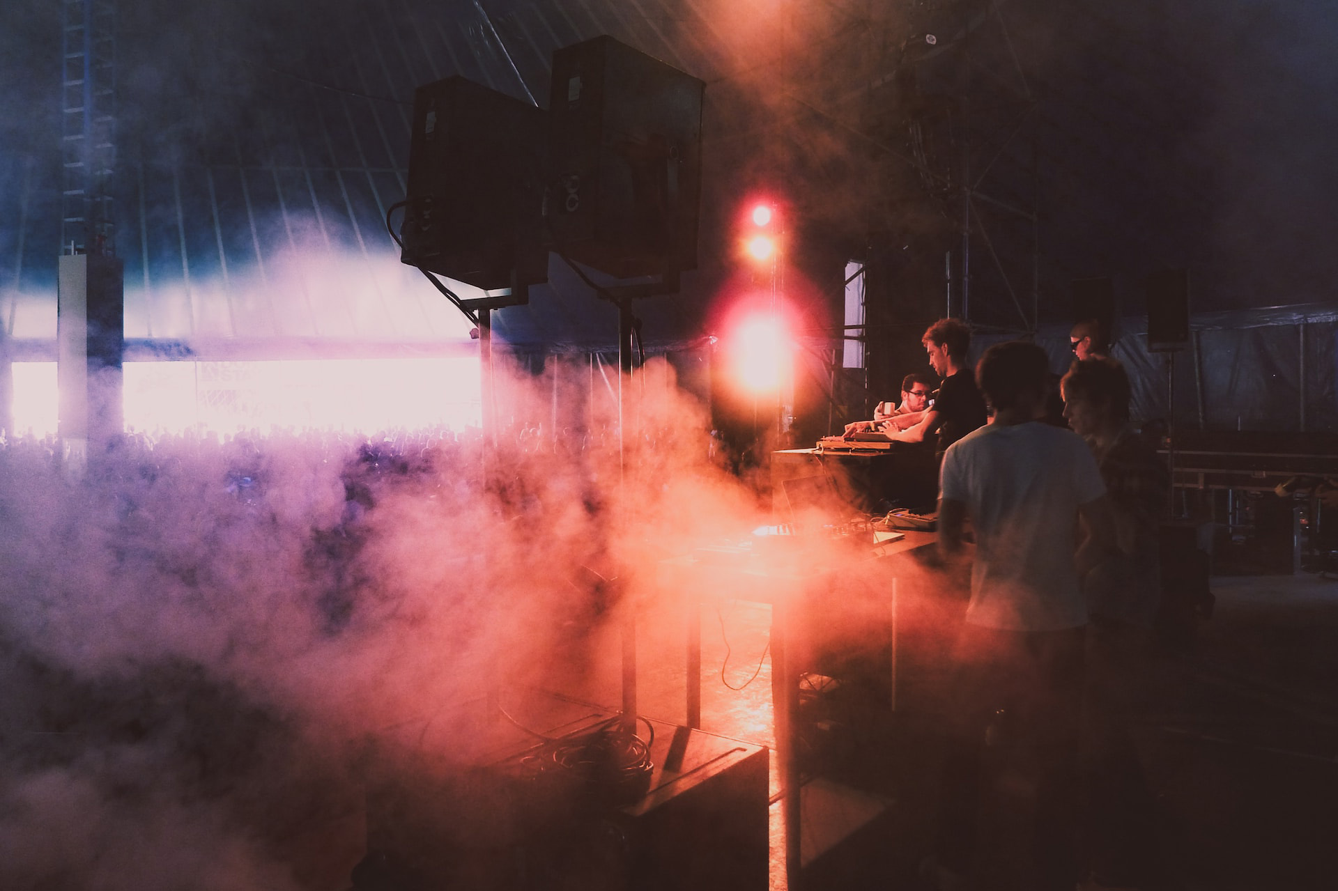 Stage-hands working in a smoky area