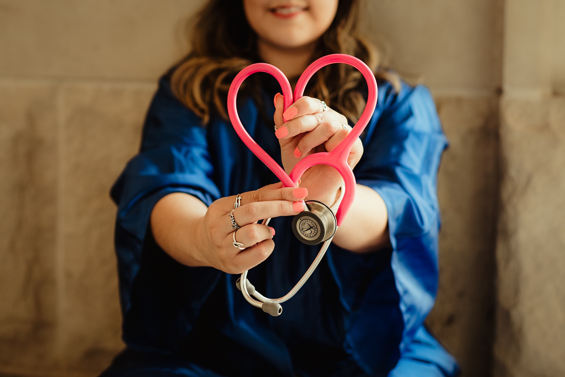 Nurse with a stethoscope in the shape of a heart