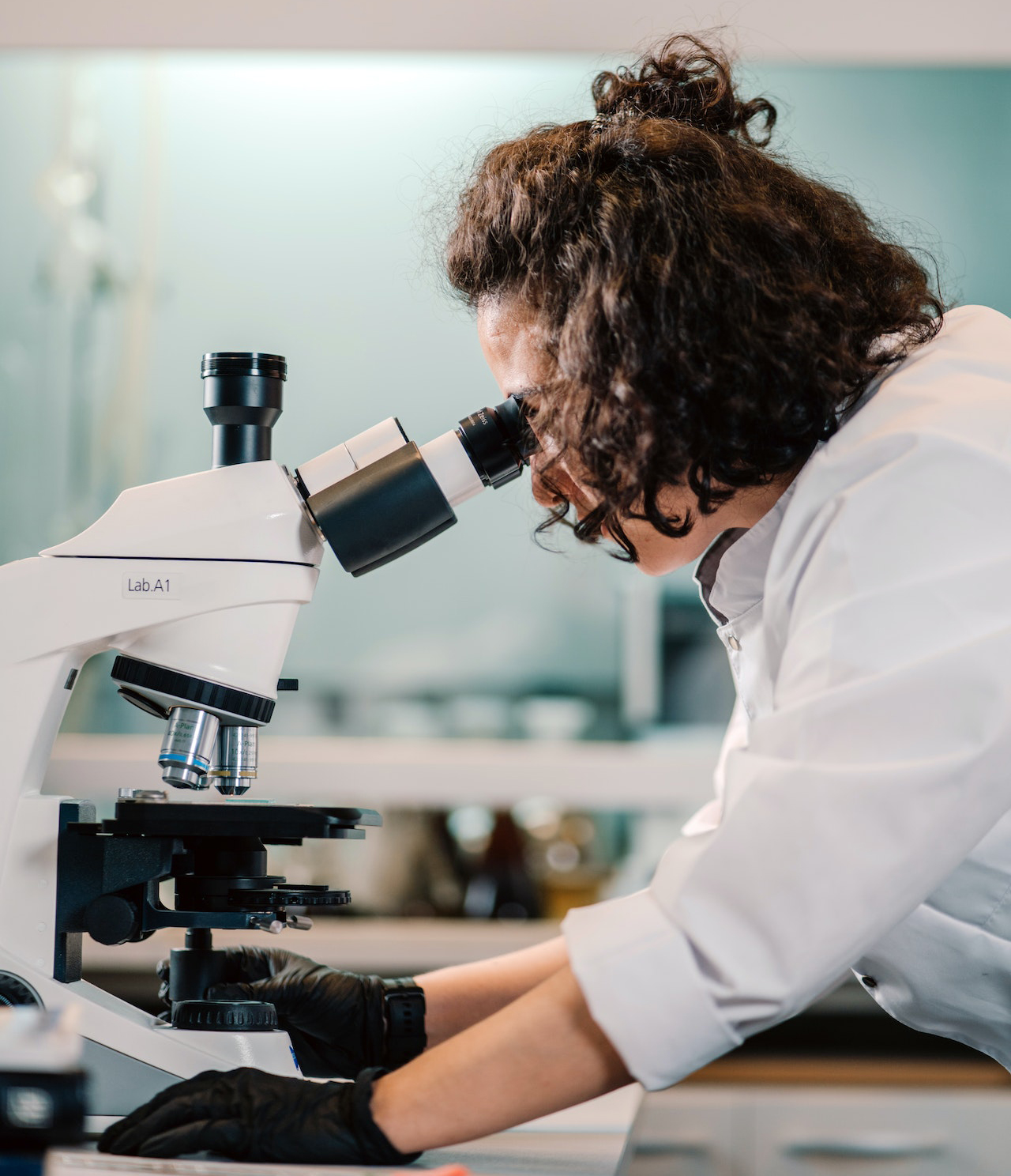 Woman looking in a microscope