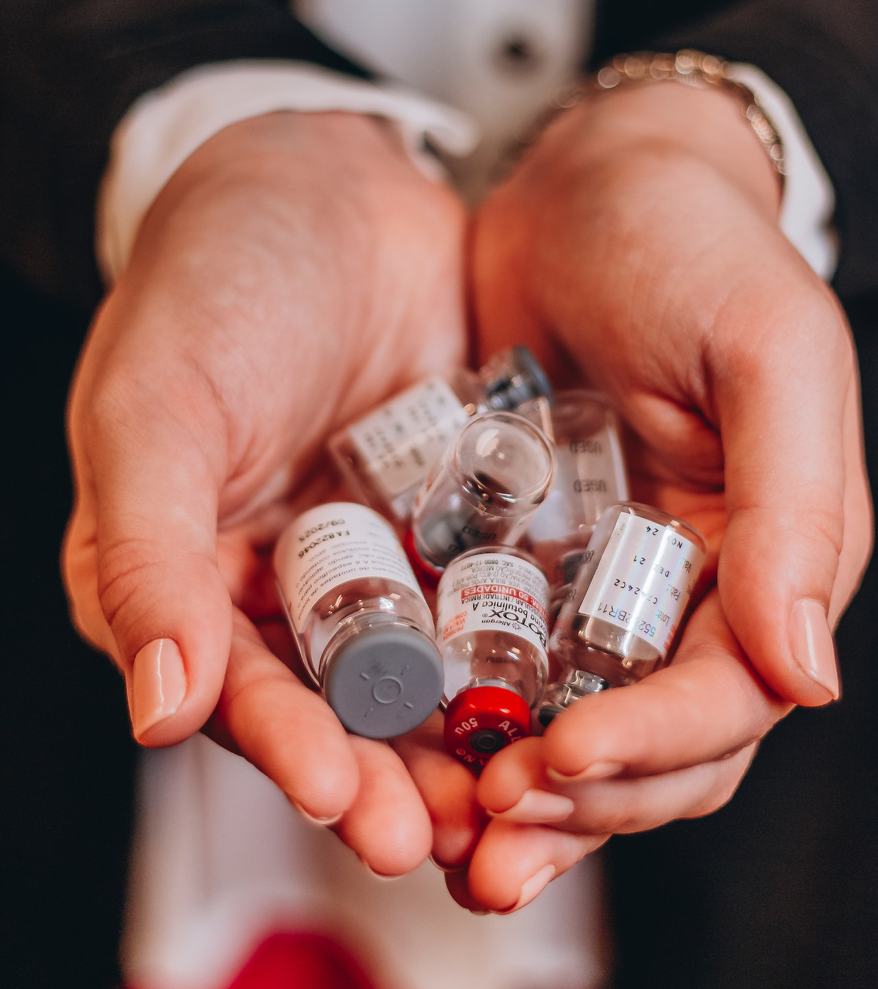 Woman holding pharmaceutical bottles