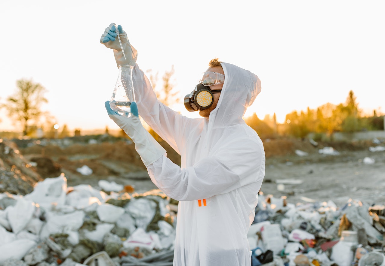 A man testing the water in a landfield