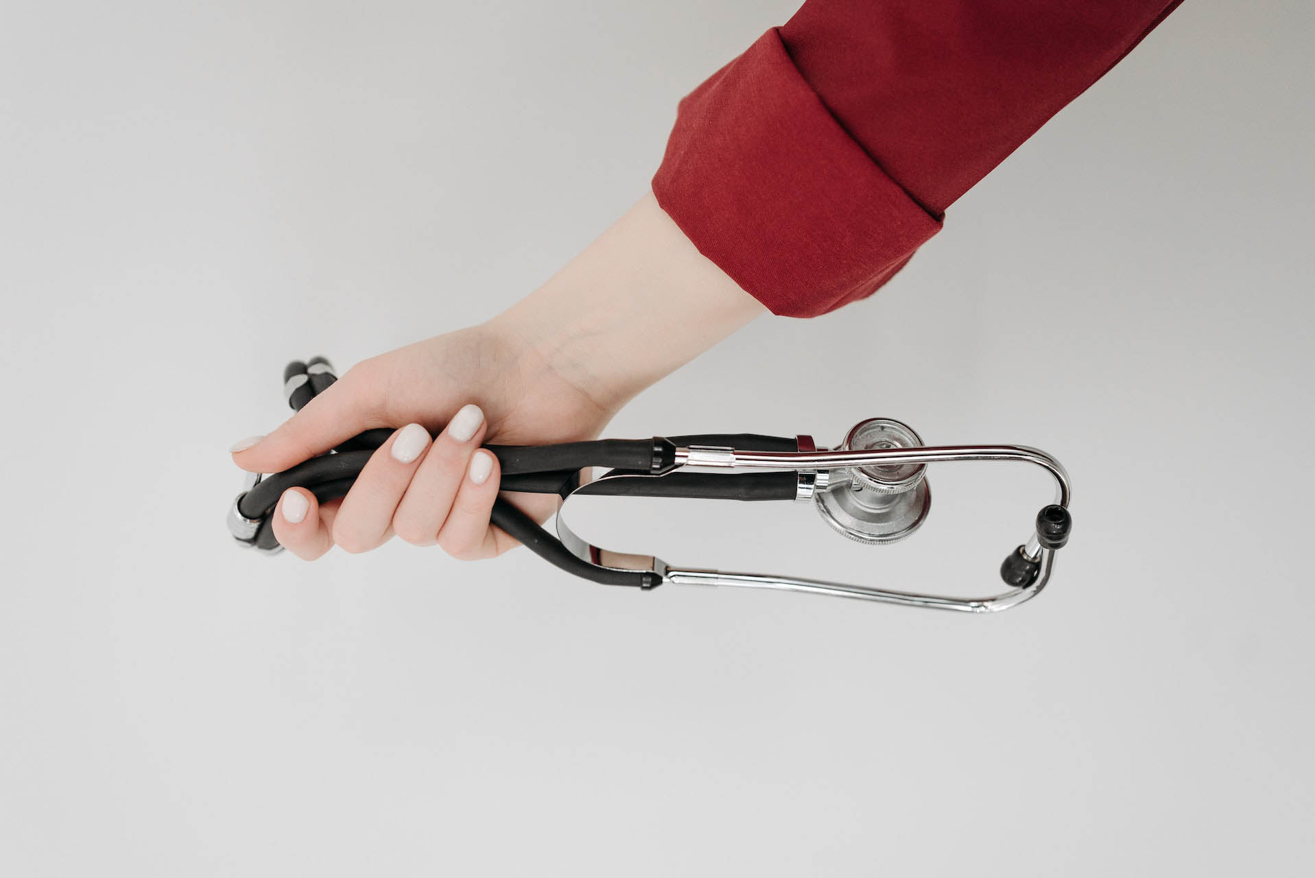 Woman holding a stethoscope