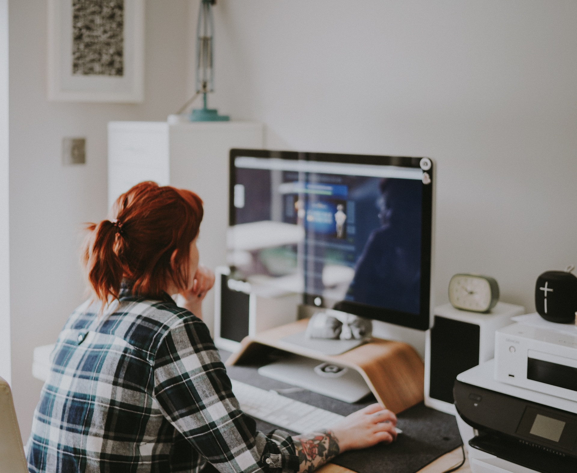 Woman sitting at a computer programming something