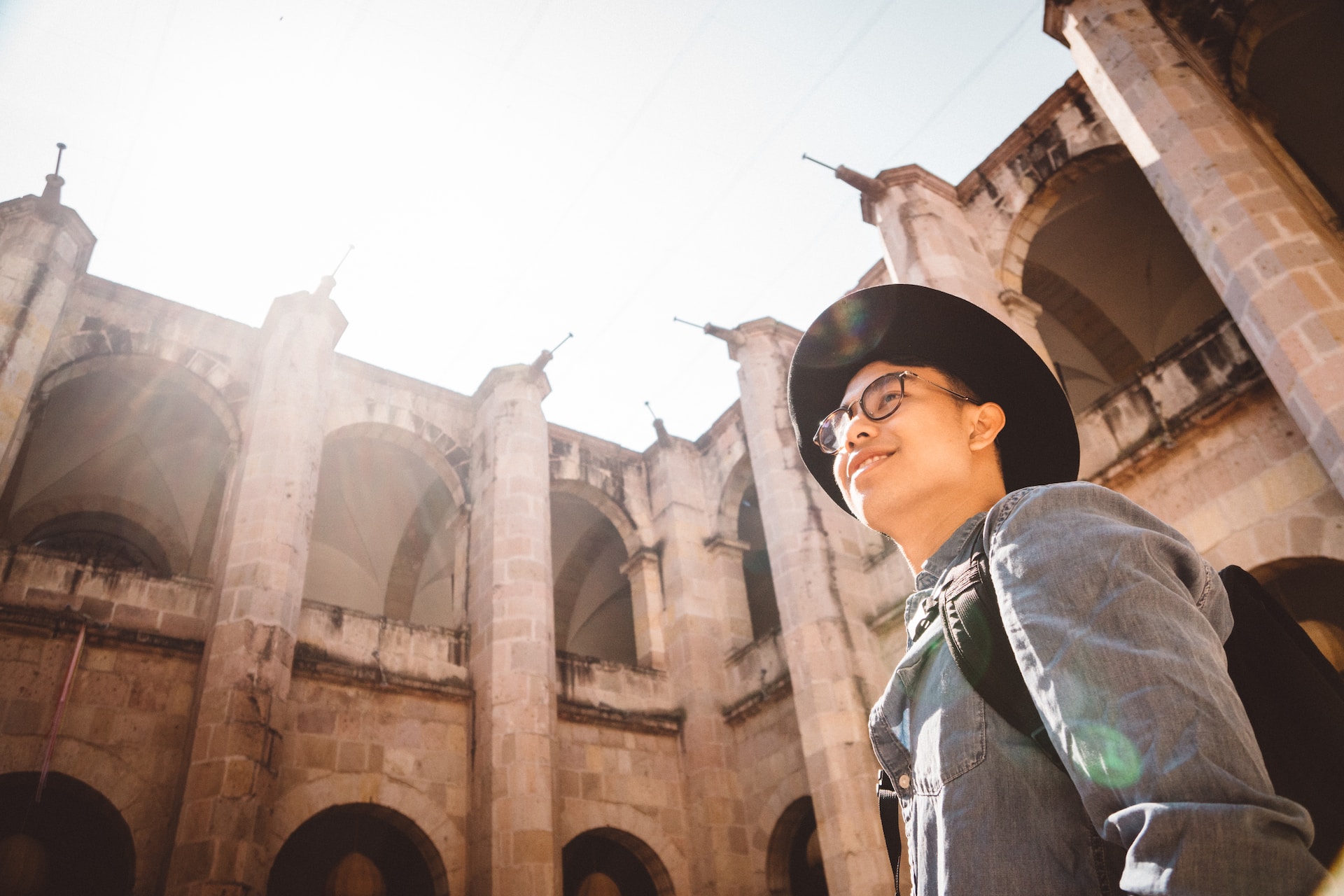 Man wandering in an art exhibit in a cultural centre in Morelia