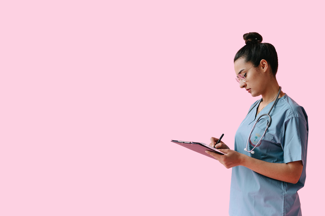 Nursing writing on a clip board