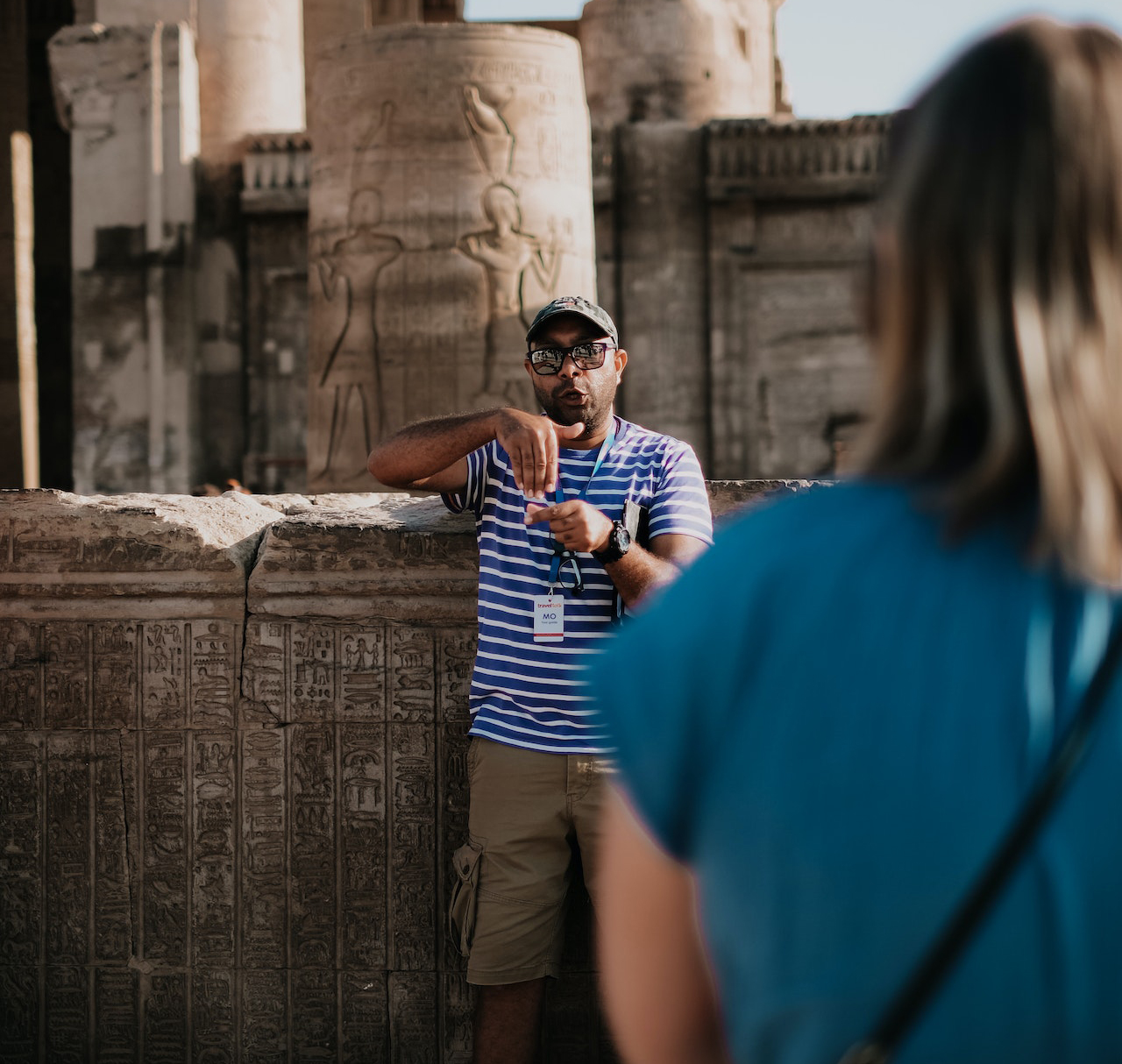A male tour guide to an Egyptian historical site