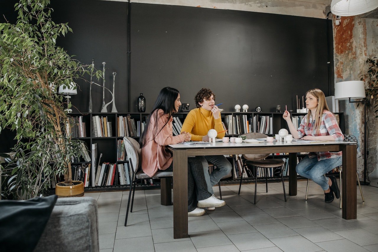 A Group of People Having a Meeting in the Office