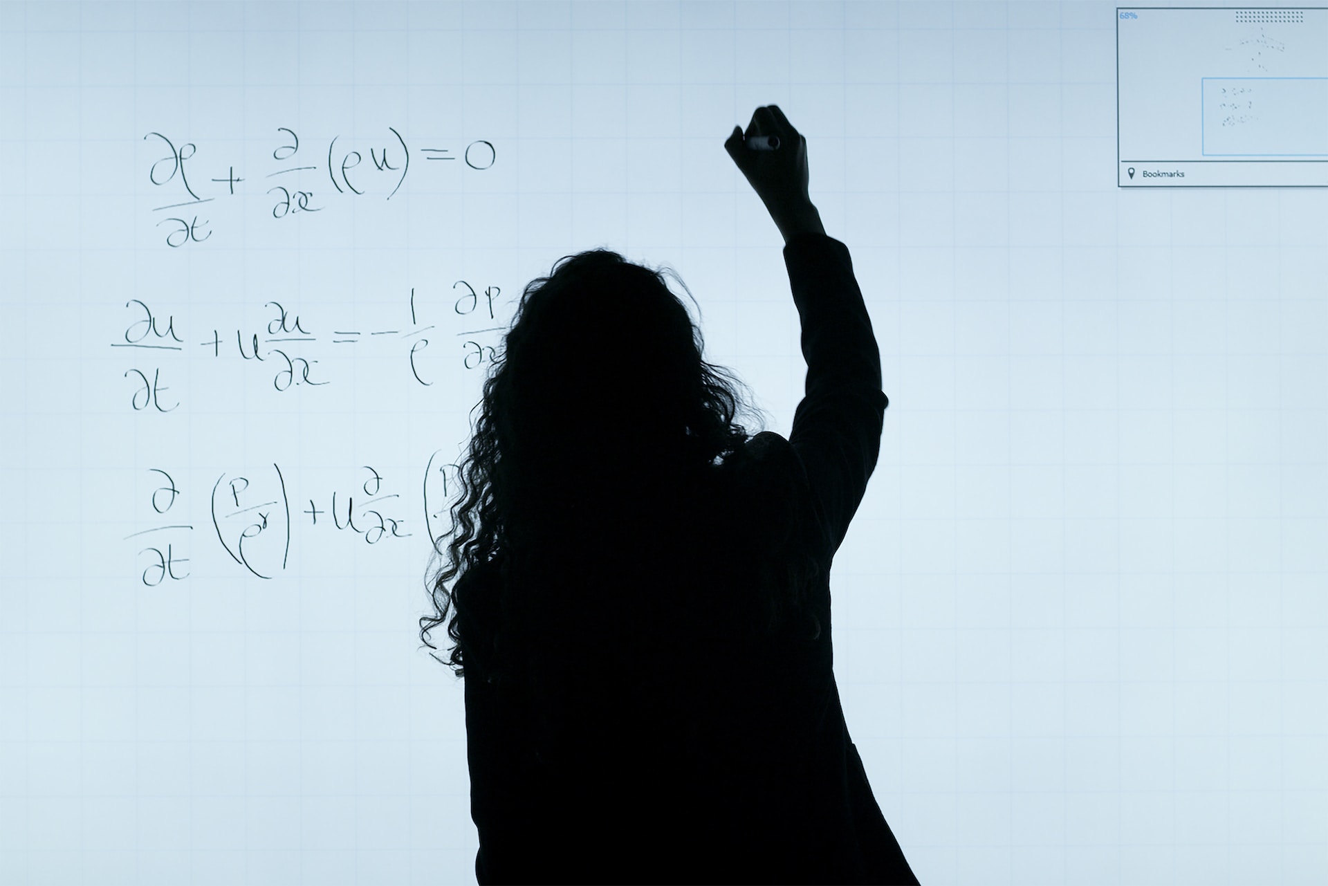 Woman writing on a board