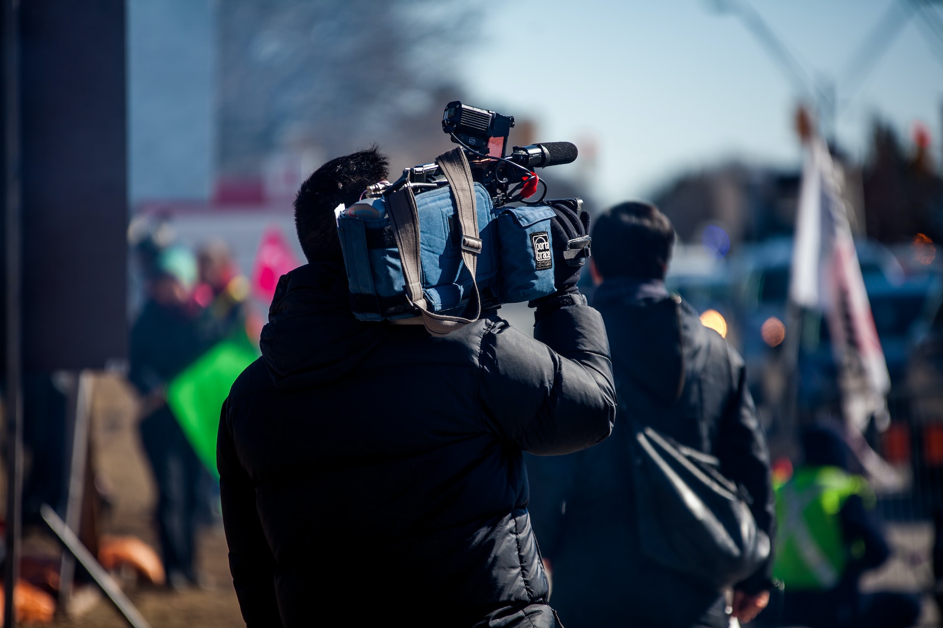 Man with a camera on his shoulder