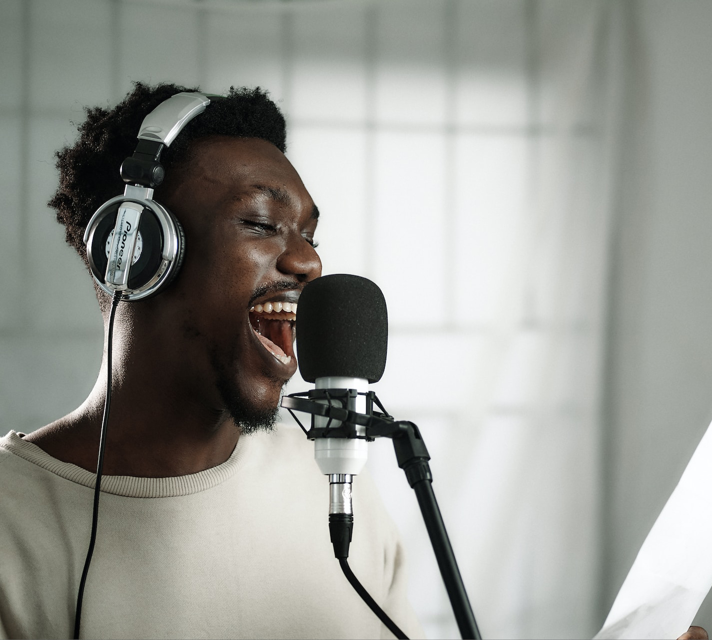 A man singing into a microphone