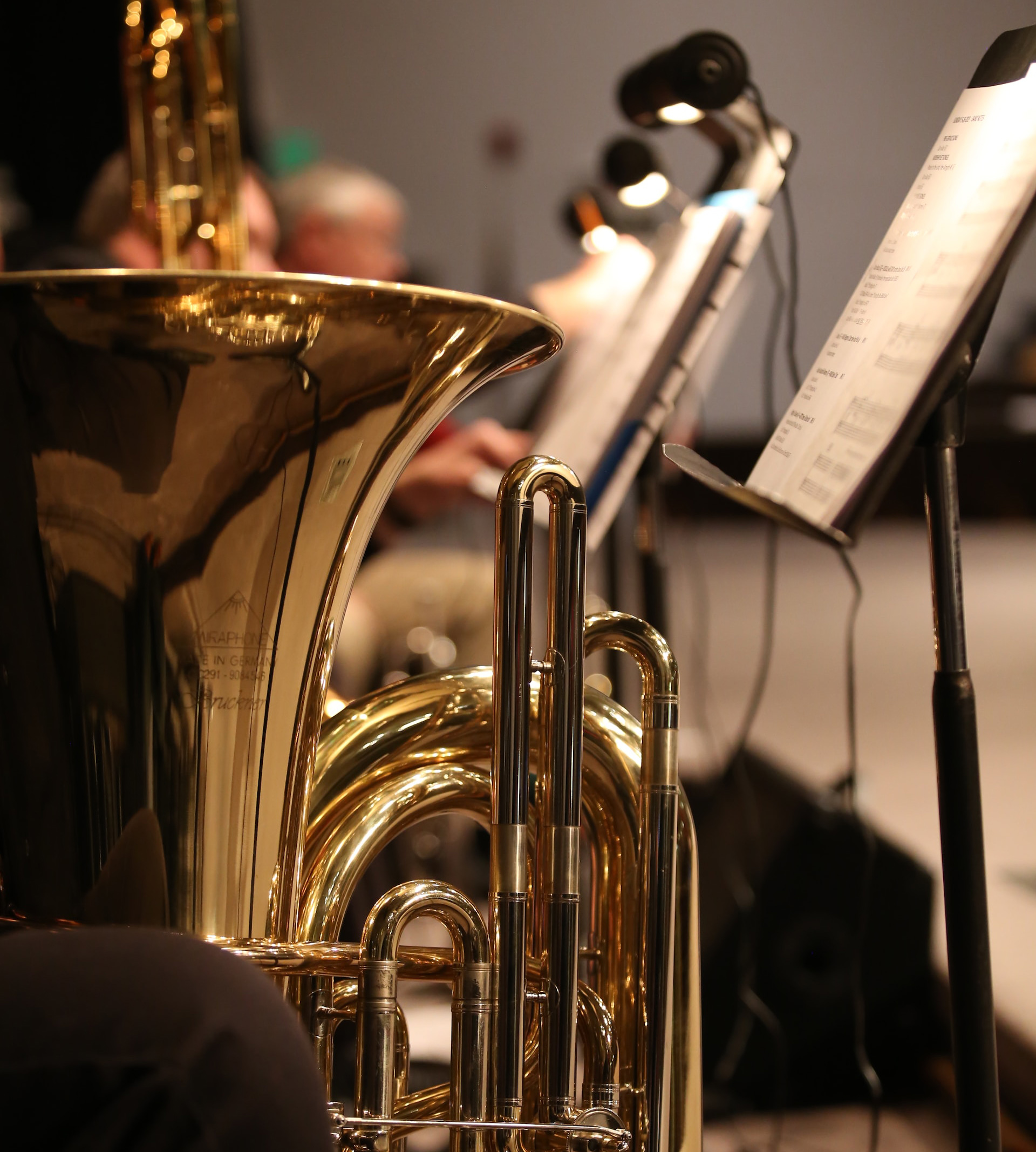 brass trumpet near white printer paper