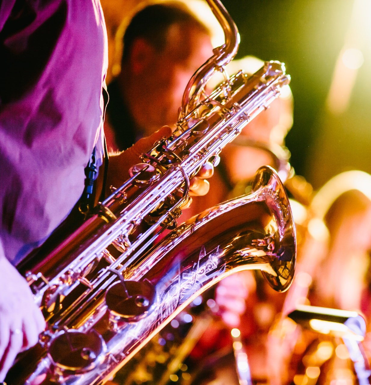 Group of musicians with the saxophone in focus