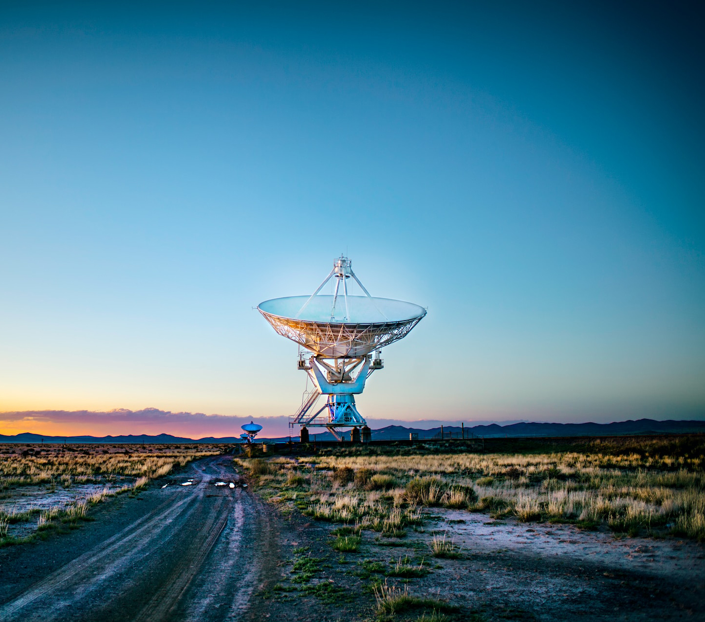 white radar telescope on grass field