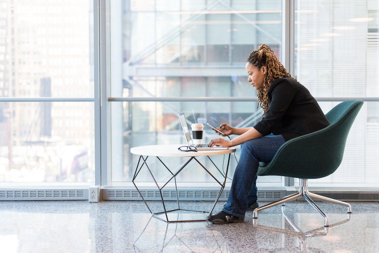 Woman Sitting on Blue and Gray Chair