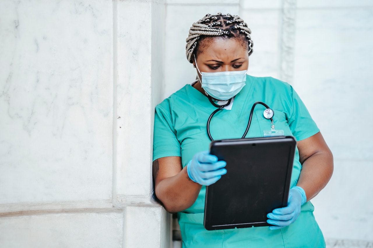 Focused woman with documents in hospital