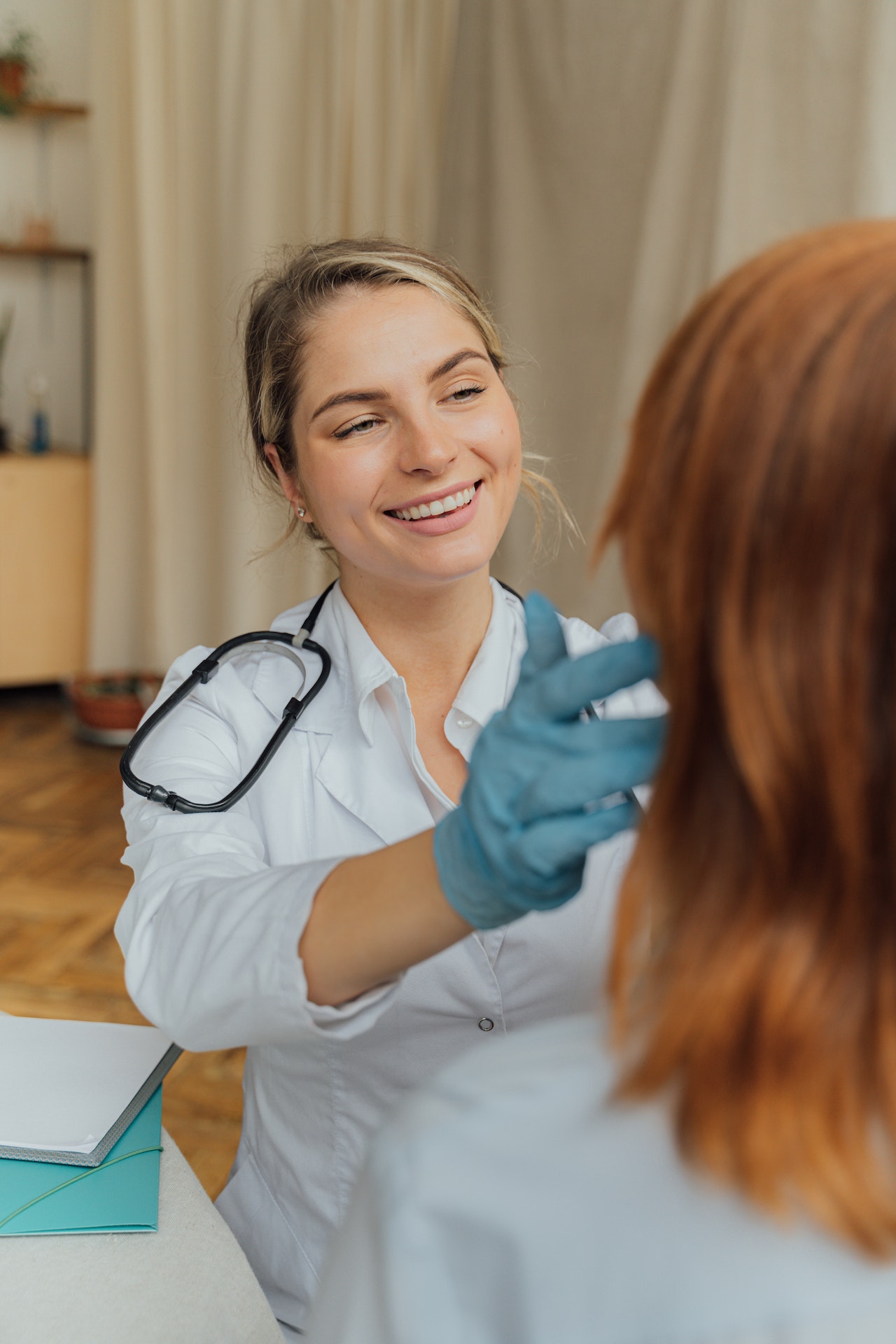 Nurse touch a patient's jaw