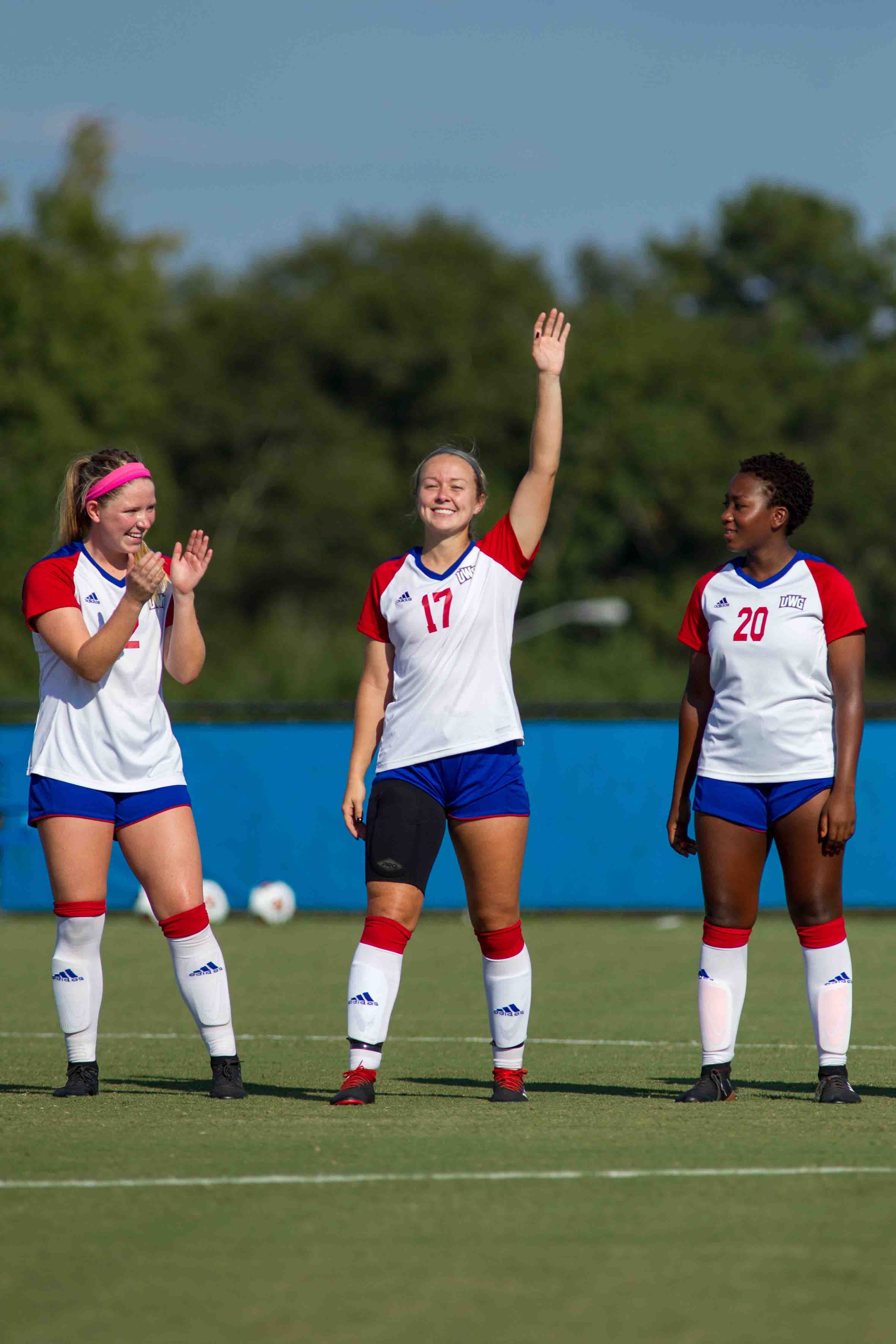 Three female soccer players