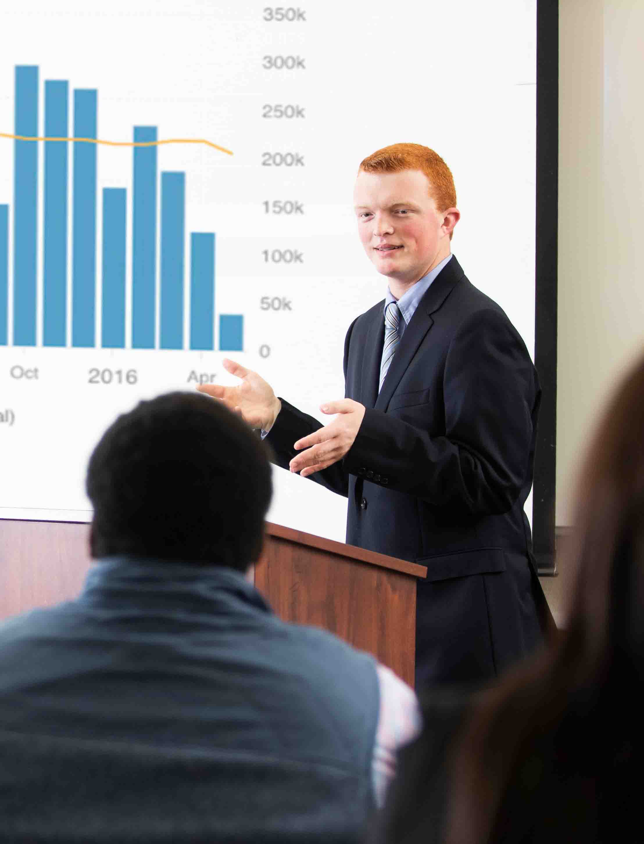student giving a presentation in business