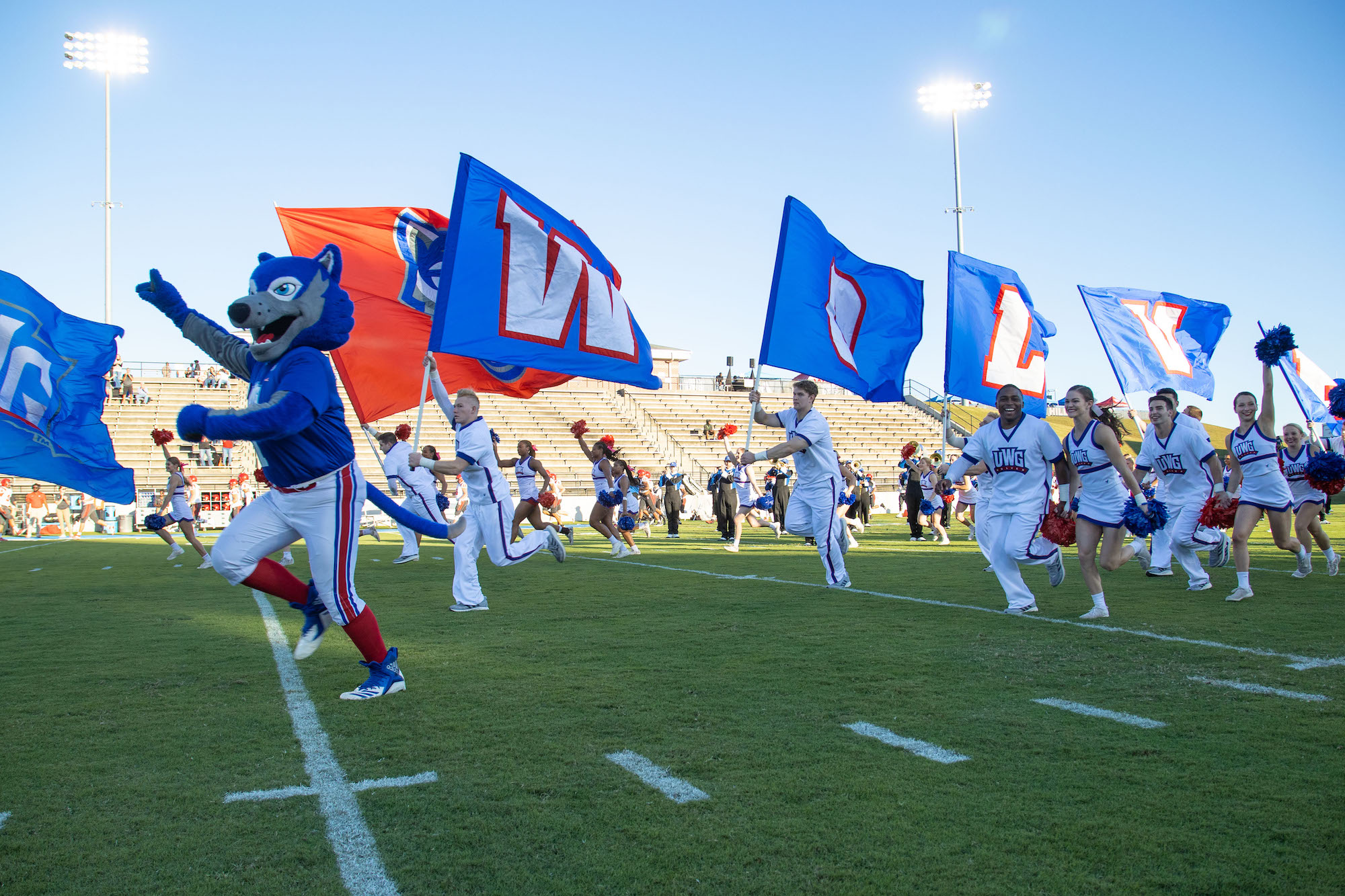 Wolves storm the field with UWG flags