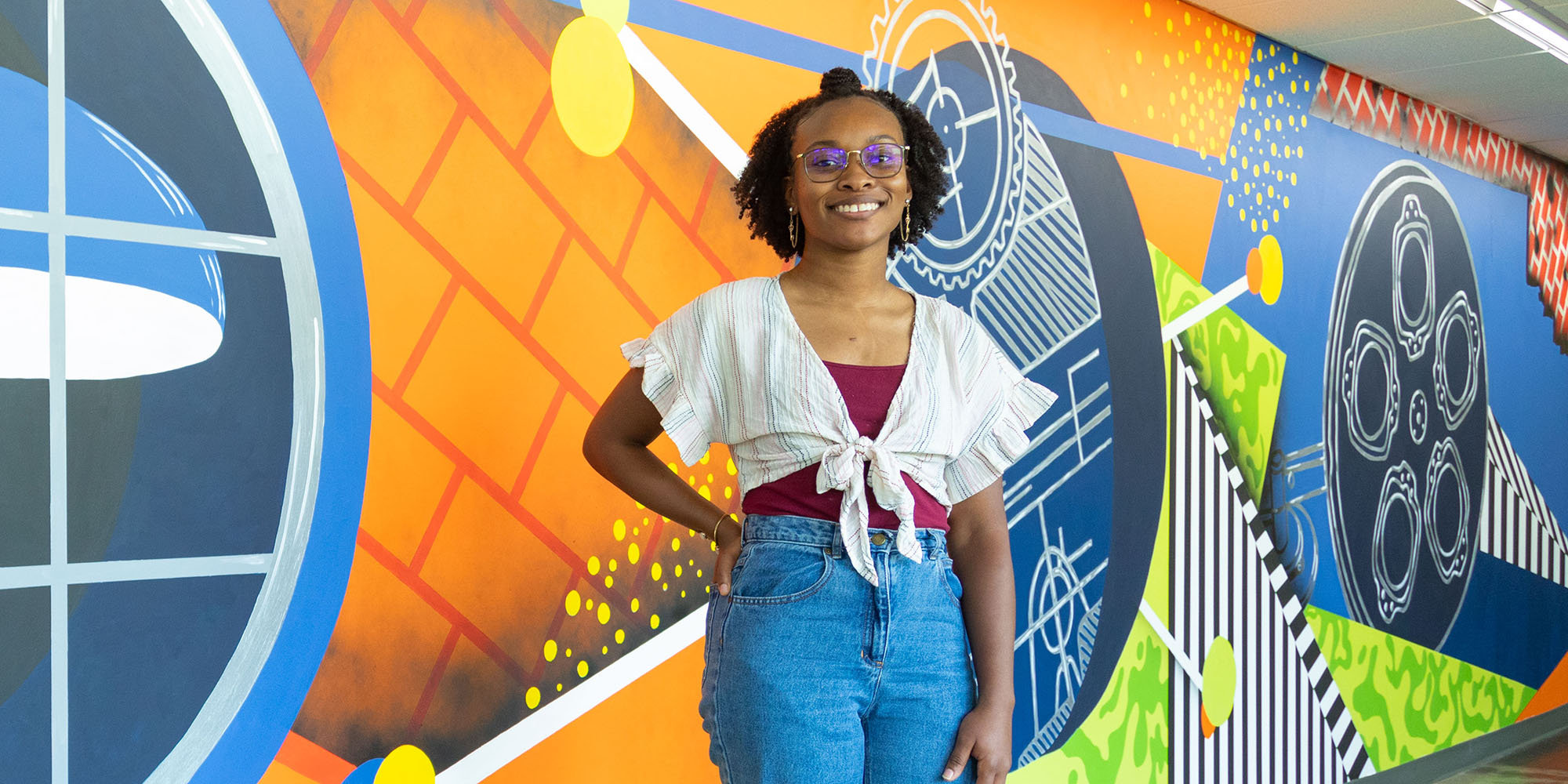 Ariana Culver in front of Newnan mural