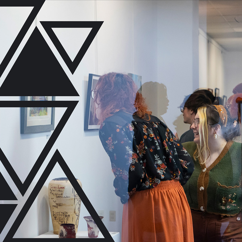 students looking at art in the gallery