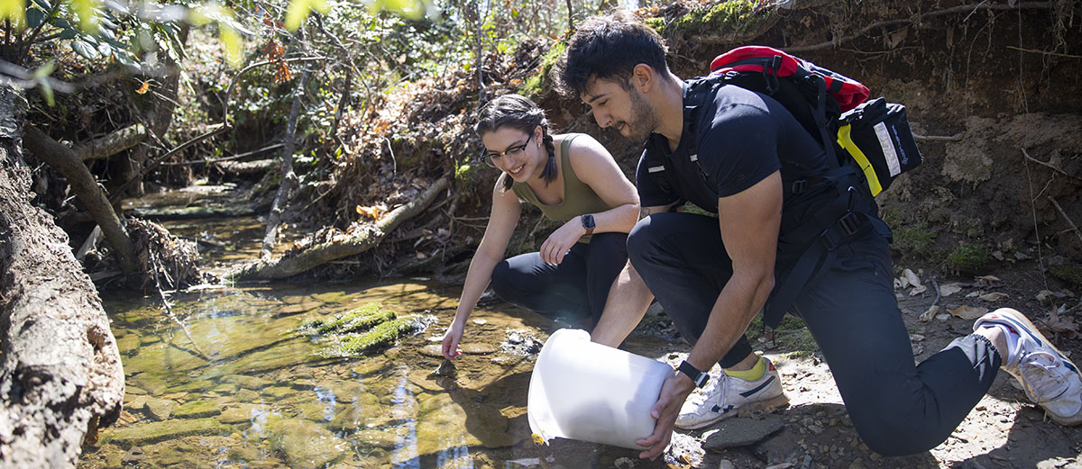 students collecting samples from river