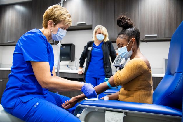 Student getting a shot in the Health Center