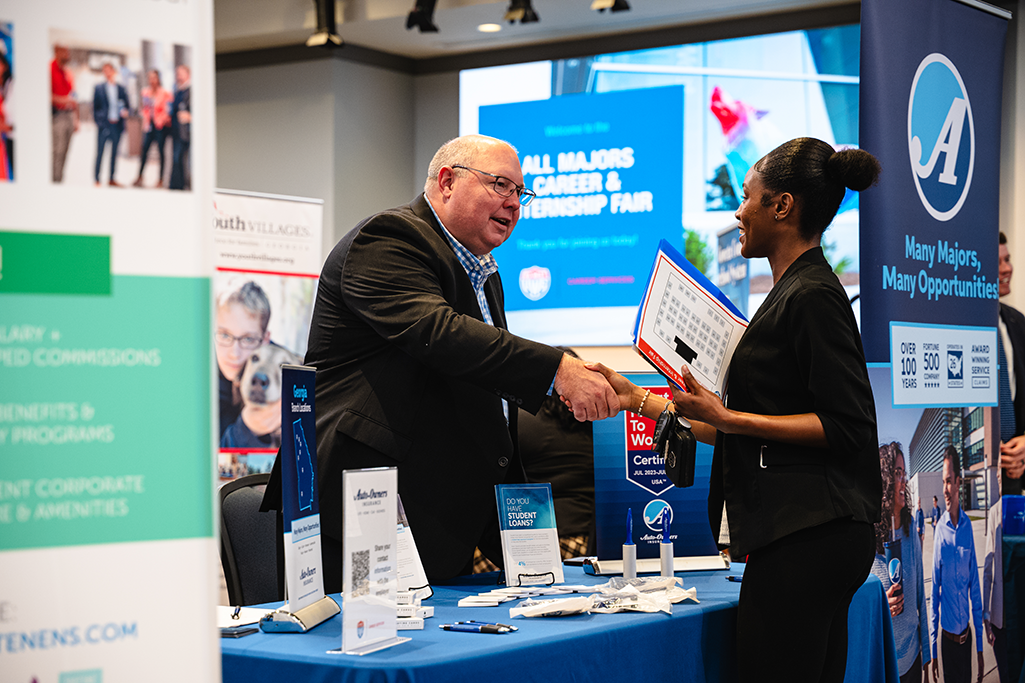Student at Career Fair talking with vendor