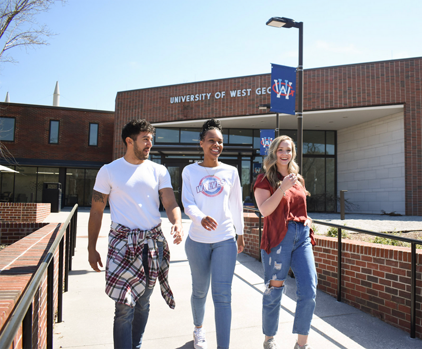 students walking outside of newnan campus building