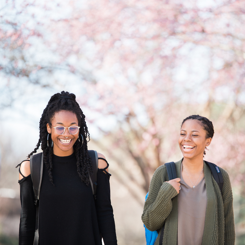two female students walking outside