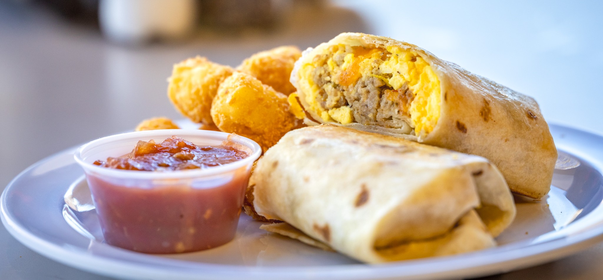 People sitting at table in dining hall. 