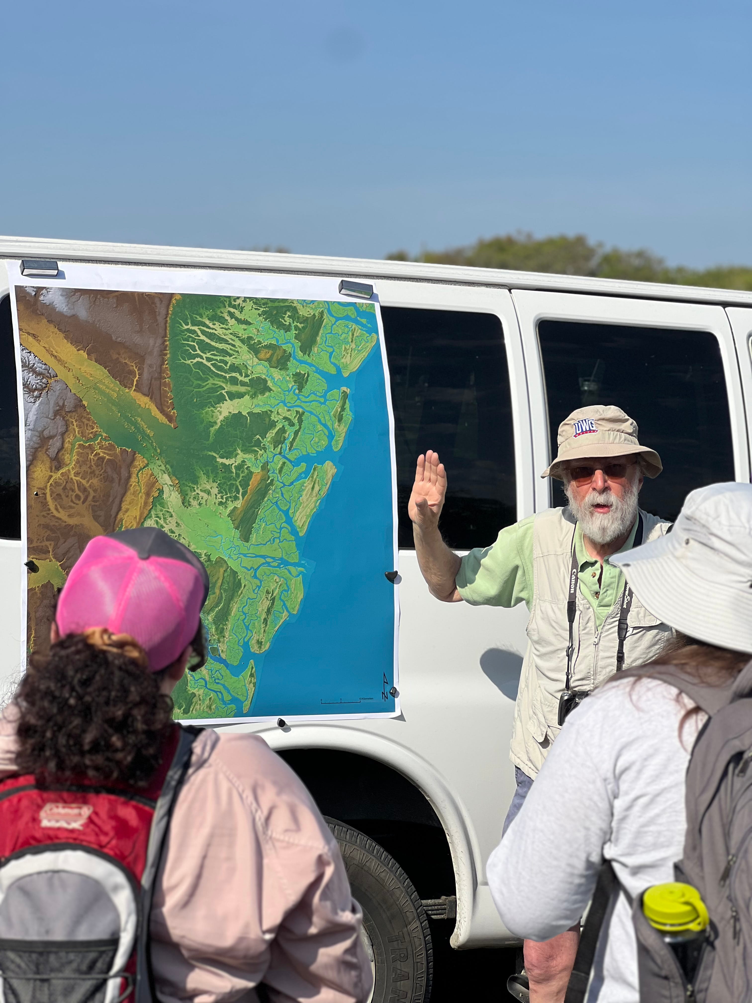 Dr. Chowns explaining a map to students