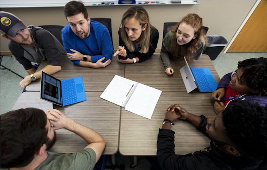 Computer science students working together.