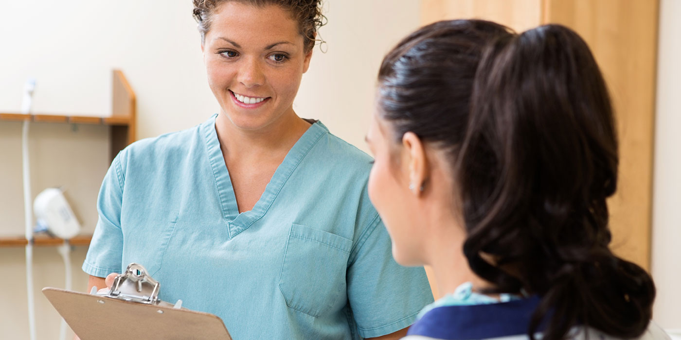 Clinical Medical Assistant helping patient