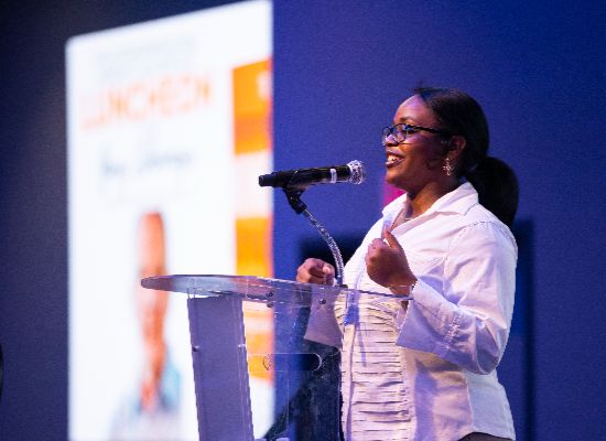 woman presenting at an event